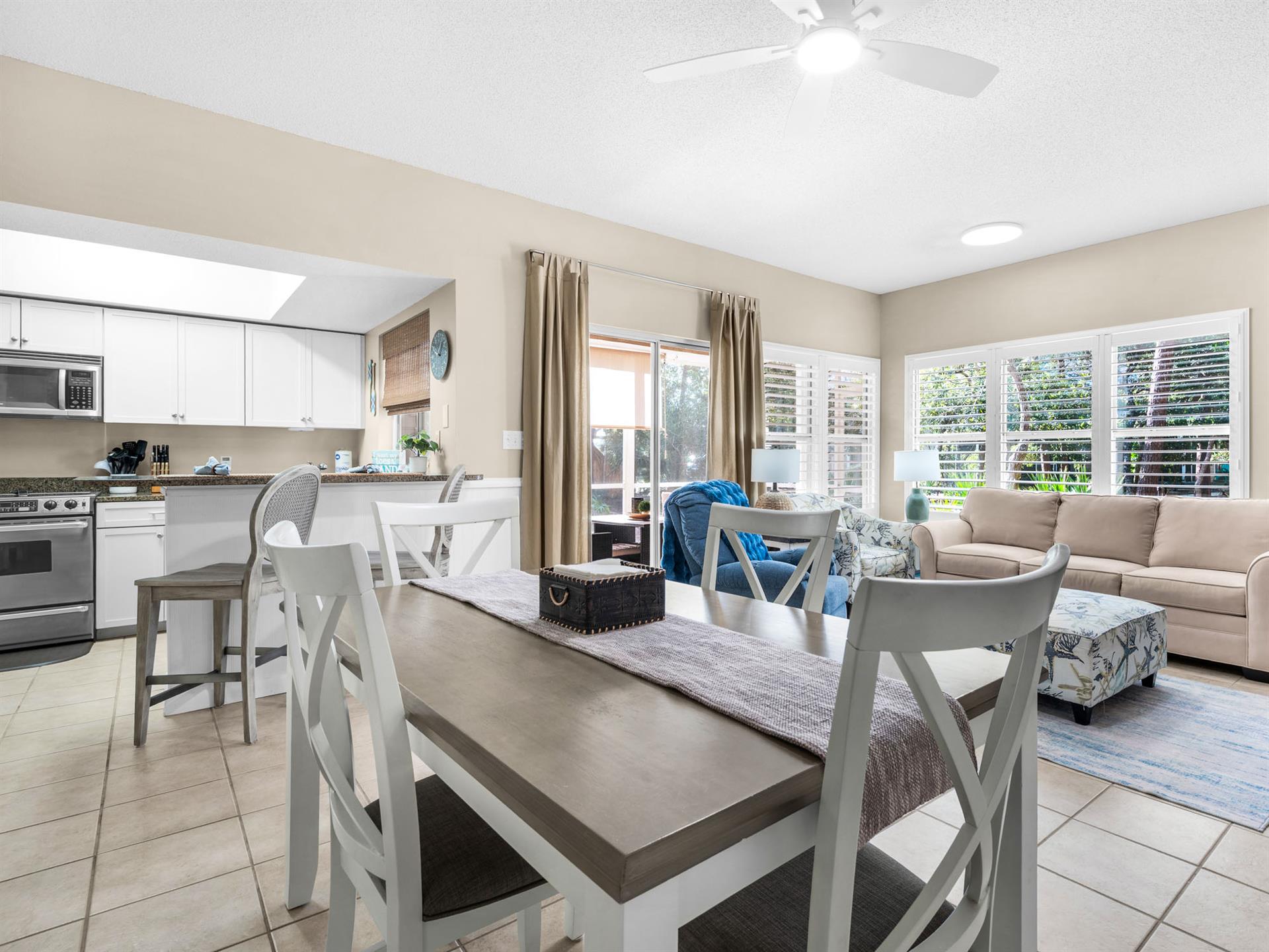 Relax in your bright, openconcept living space where the kitchen flows into a cozy dining area and comfortable lounge—perfect for gathering.