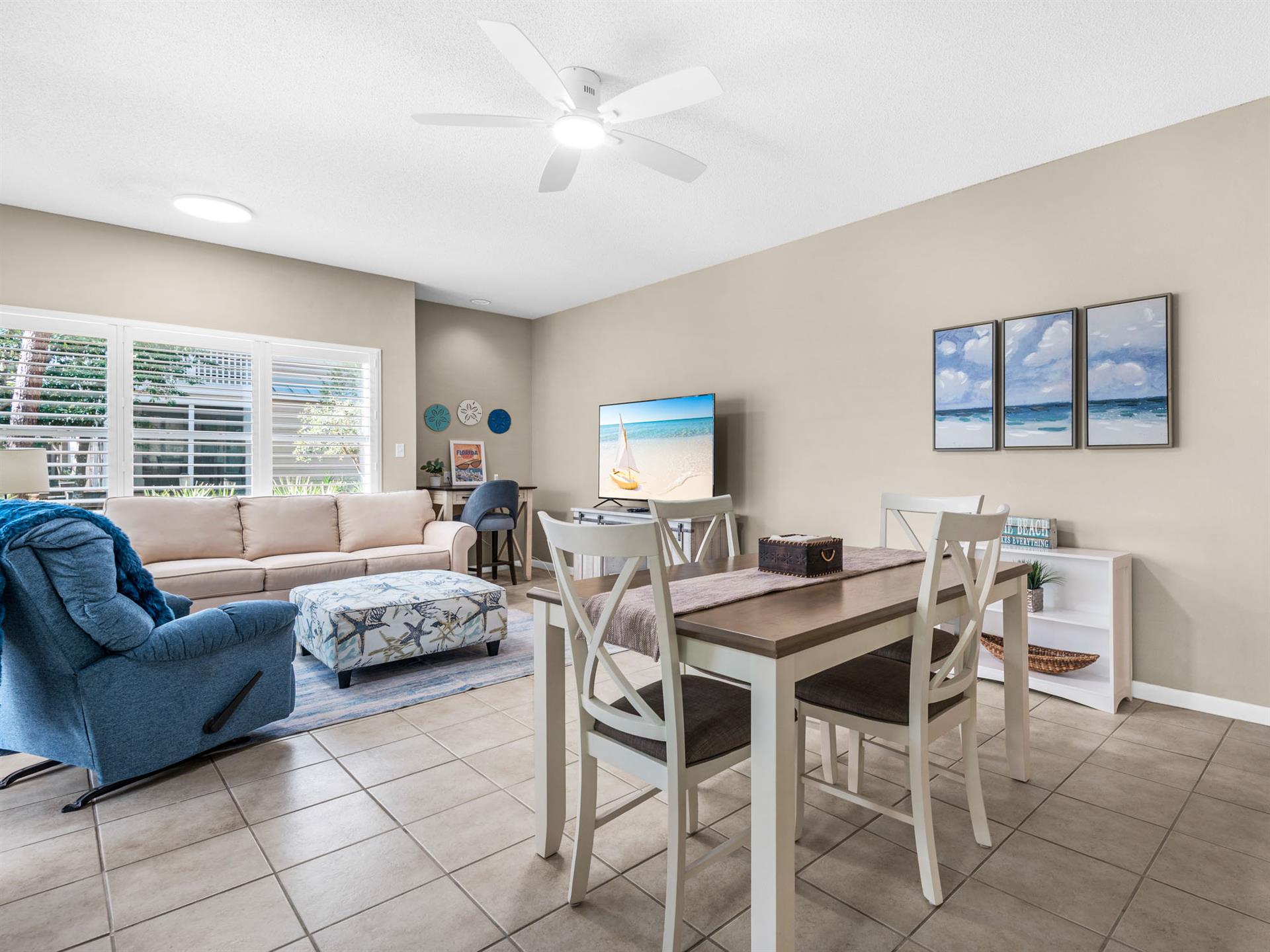 Relax in your bright, coastalinspired living space where ocean artwork and comfortable seating create the perfect beach getaway atmosphere.