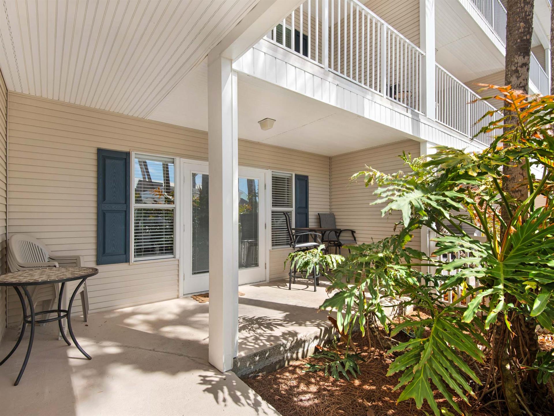 The private covered patio welcomes with comfortable seating