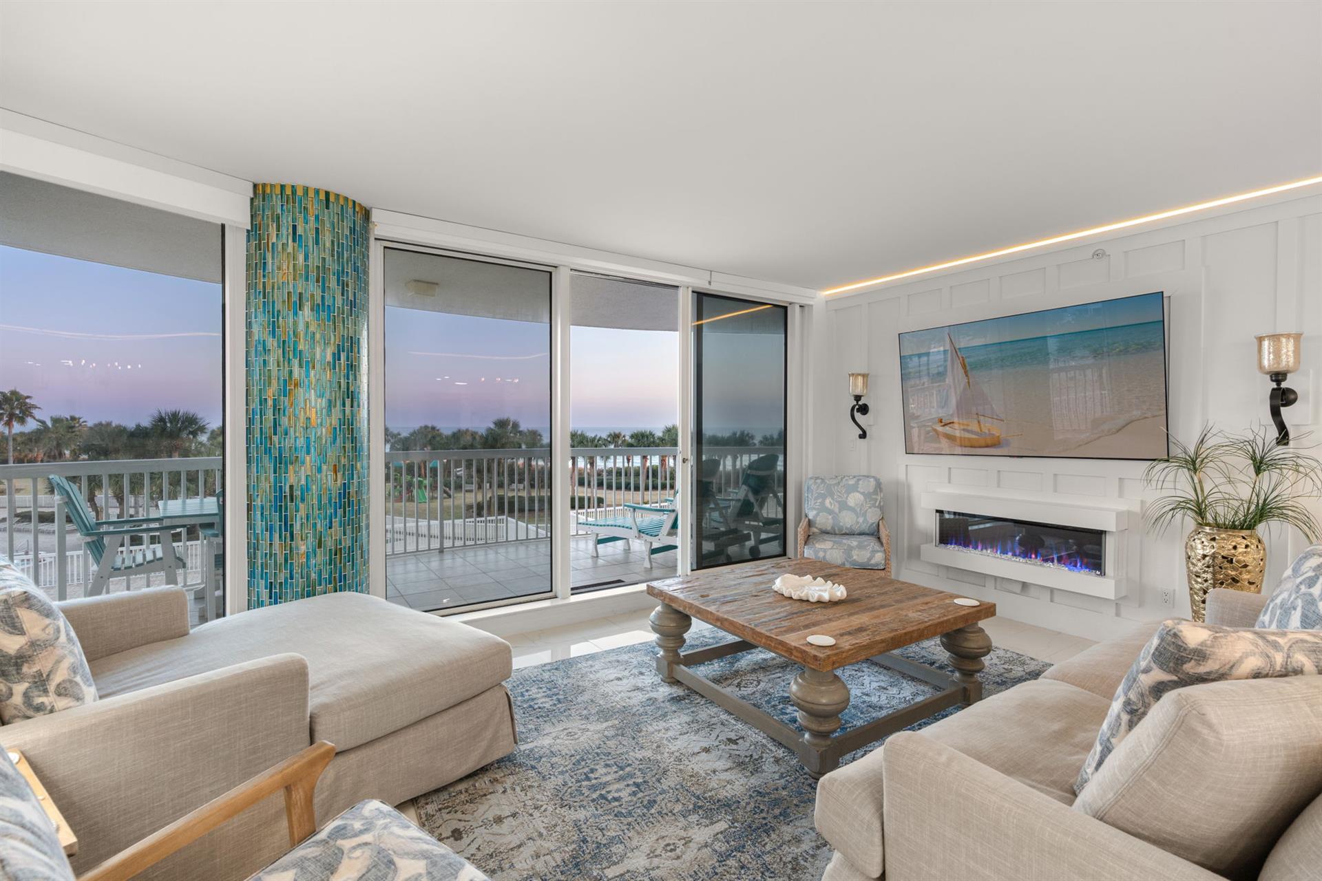 Living Room with Mounted TV and Gulf Views