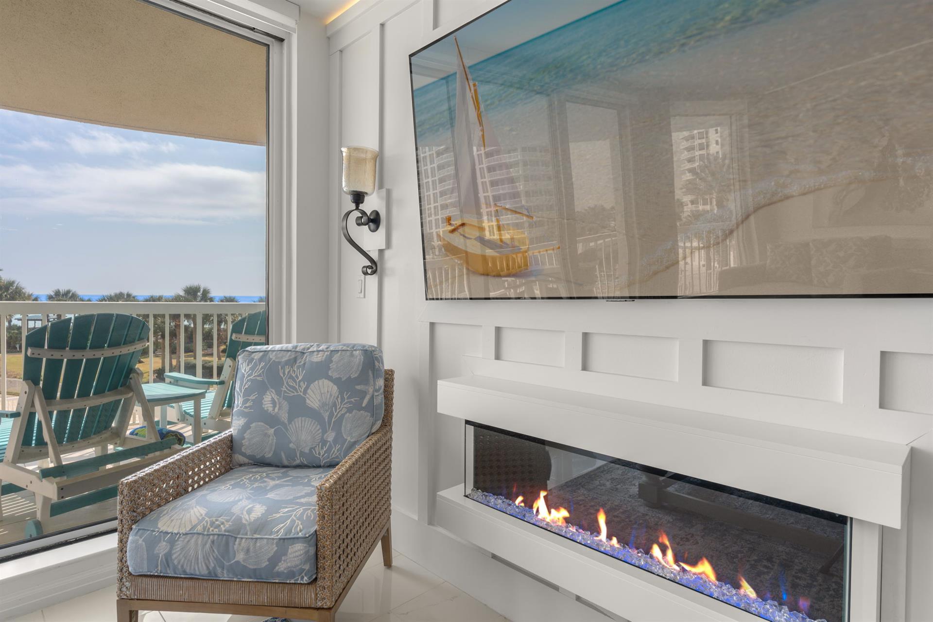Cozy up by your modern fireplace while enjoying ocean views from this elegant coastal retreat.