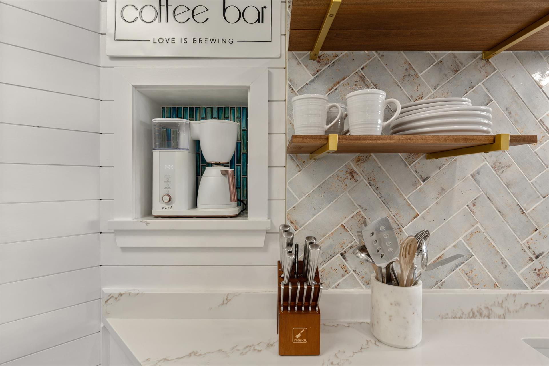 Your coffee bar awaits with premium brewing equipment, fresh mugs, and everything needed for perfect morning rituals.