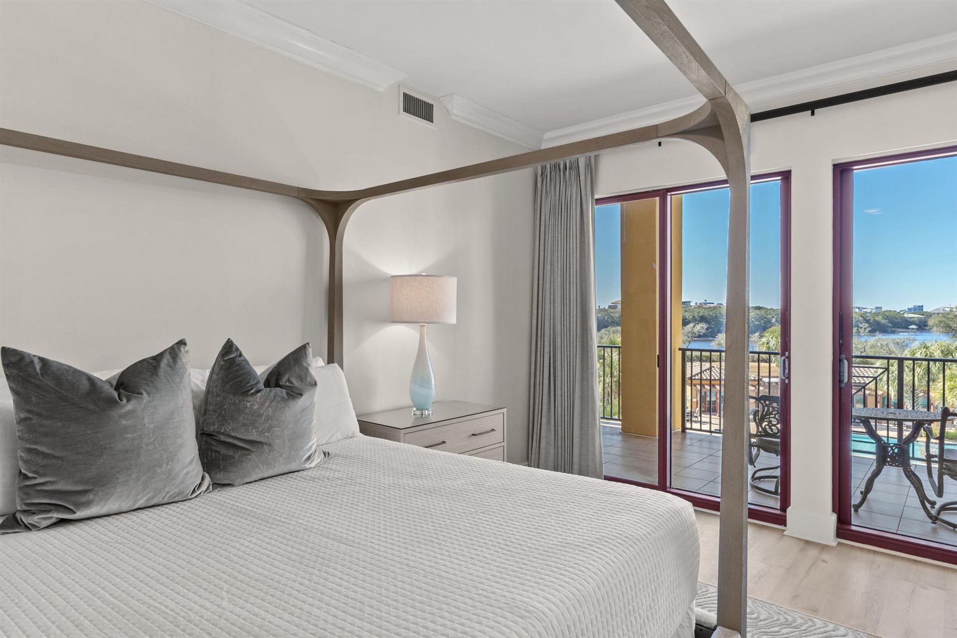 Wake up in your serene bedroom with gulf and lake views. Step onto your private balcony for morning coffee.
