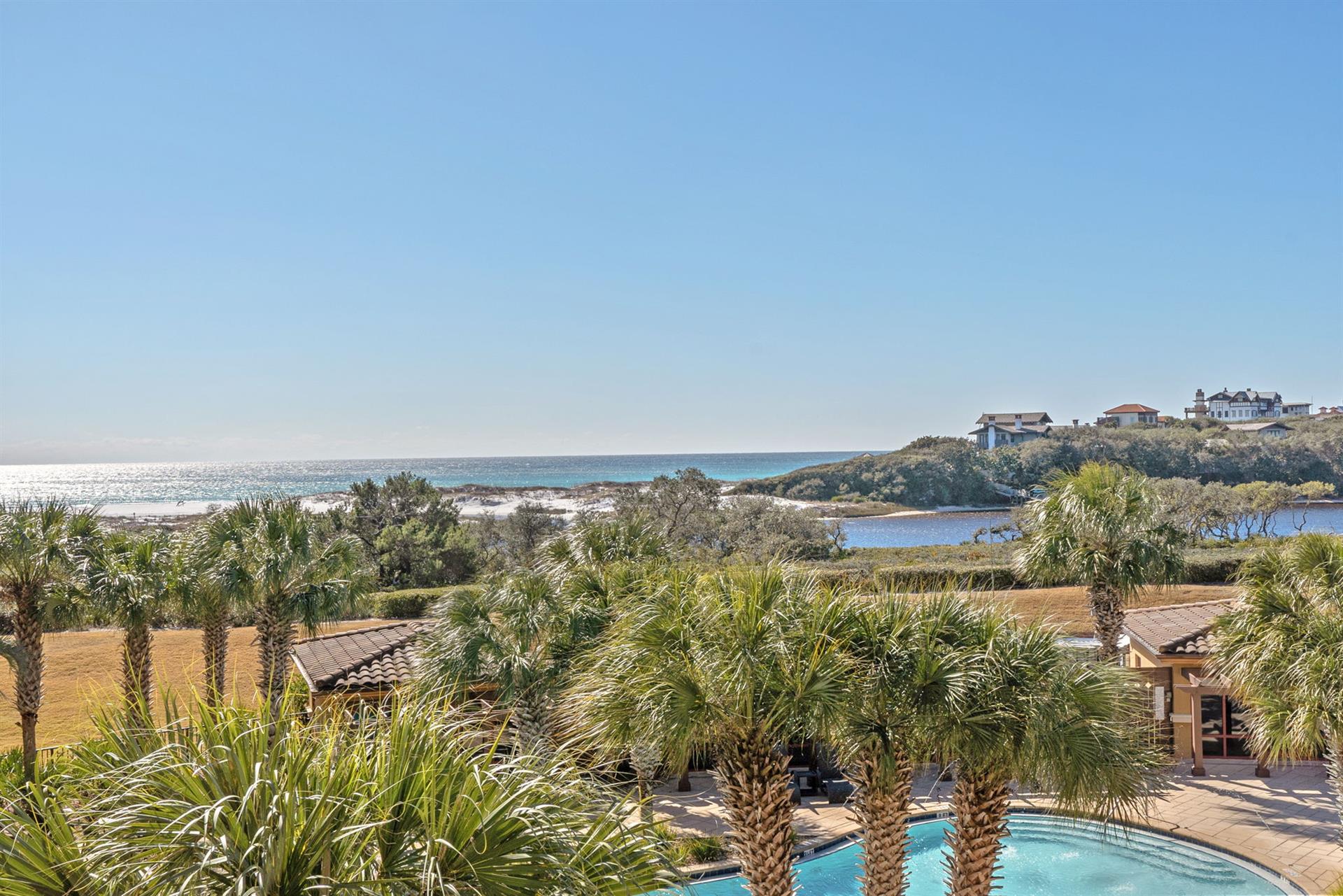 Sweeping coastal views stretch across pristine beaches and azure waters from this elevated gulf front location.