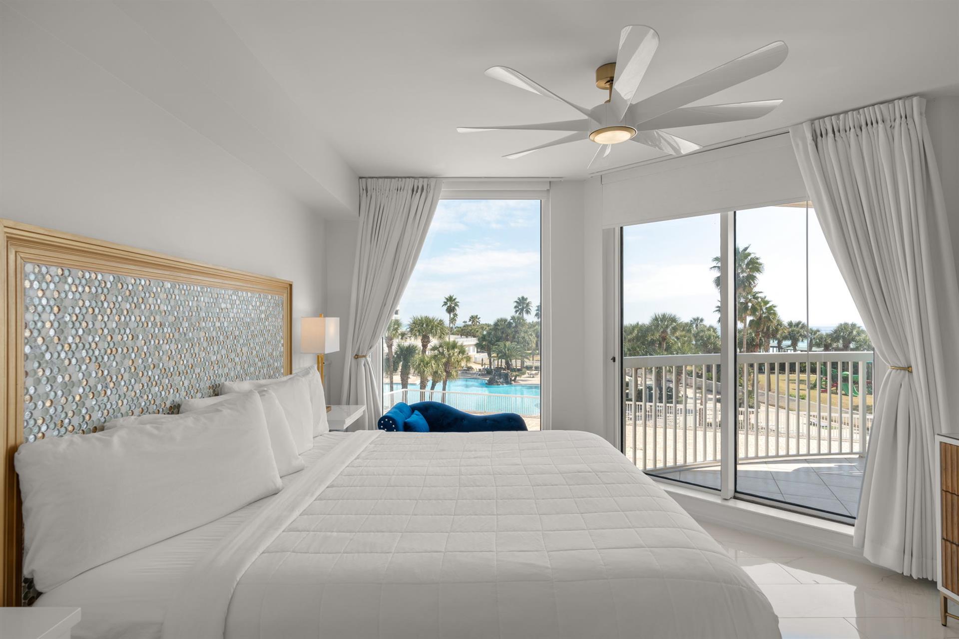 Bedroom 2 with a view of one of the Community Pools