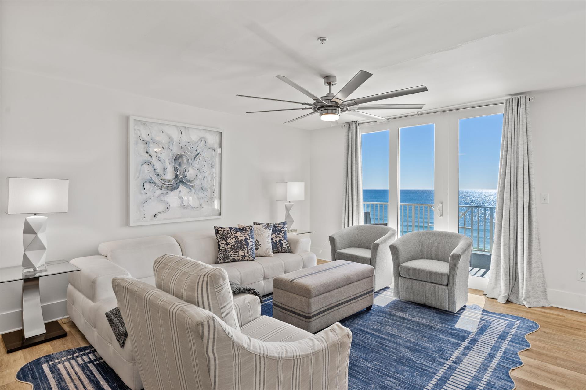 The elegant living area with  floor to ceiling windows.