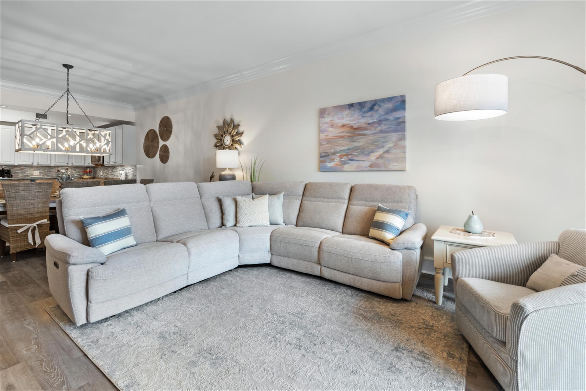 Relax in a cozy living space featuring coastal décor and two plush recliners.