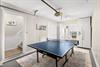 Challenge friends to ping pong in your private game room