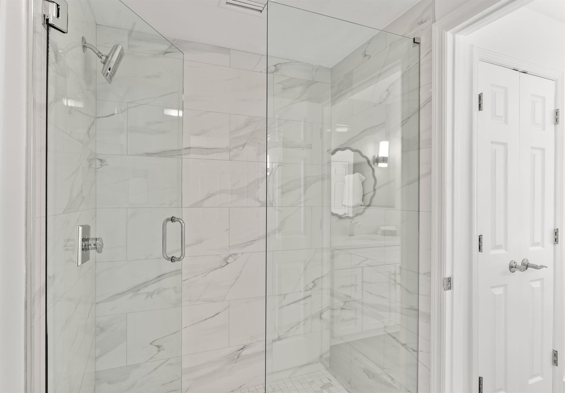 Step into the spalike marble shower.