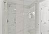 Step into the spalike marble shower.
