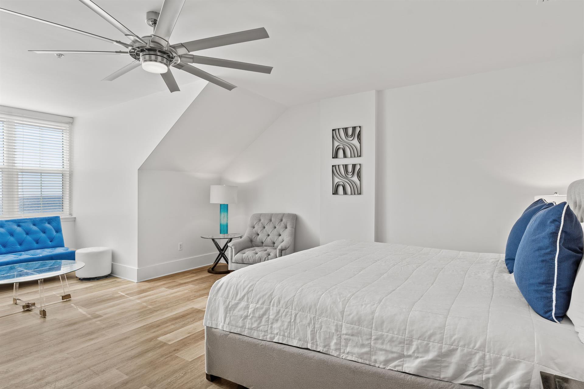 The King master suite also features a cozy reading chair.