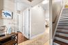 Step into 3119 welcoming entryway where coastal charm meets modern comfort, featuring beautiful hardwood floors and charming nautical touches.