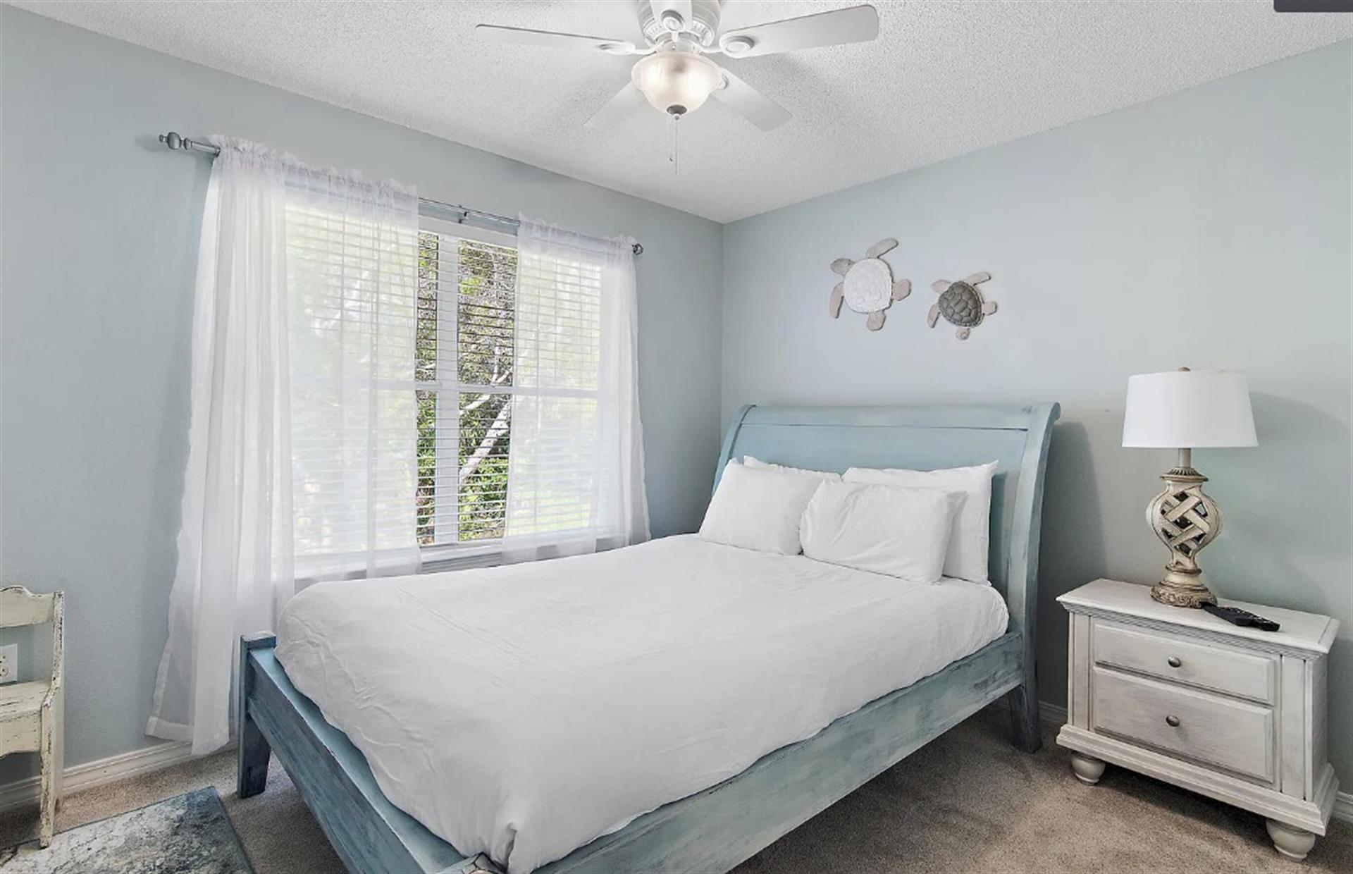 Bedroom 2  Drift off to peaceful sleep in your serene coastalthemed bedroom, complete with soft linens