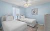 Bedroom 3  Drift off peacefully in your serene twin bedroom with soft blue walls and coastal charm.