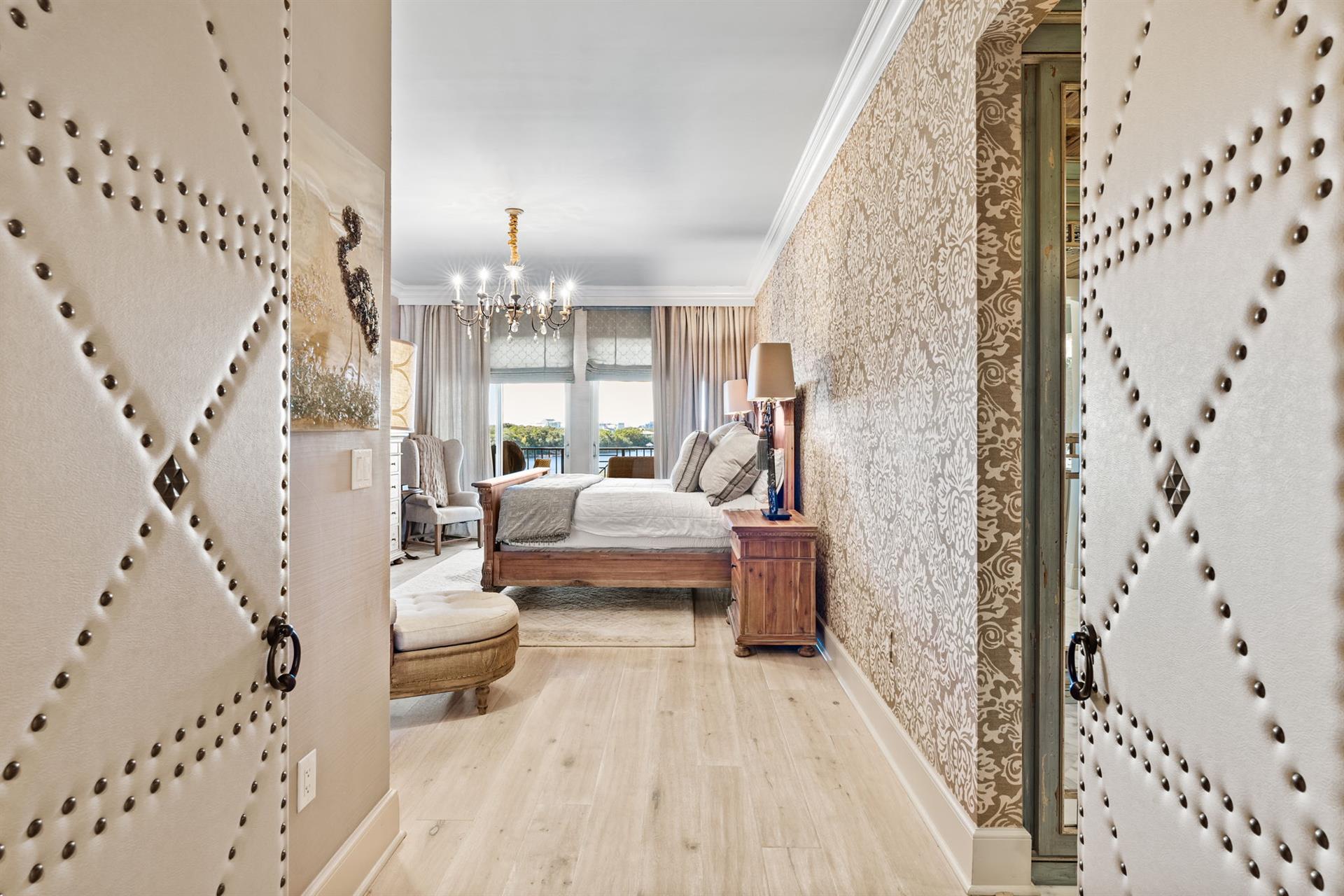 Elegant leather doors welcome you into the private master suite.