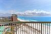 Sweeping beachfront views showcase pristine white sand and turquoise waters.