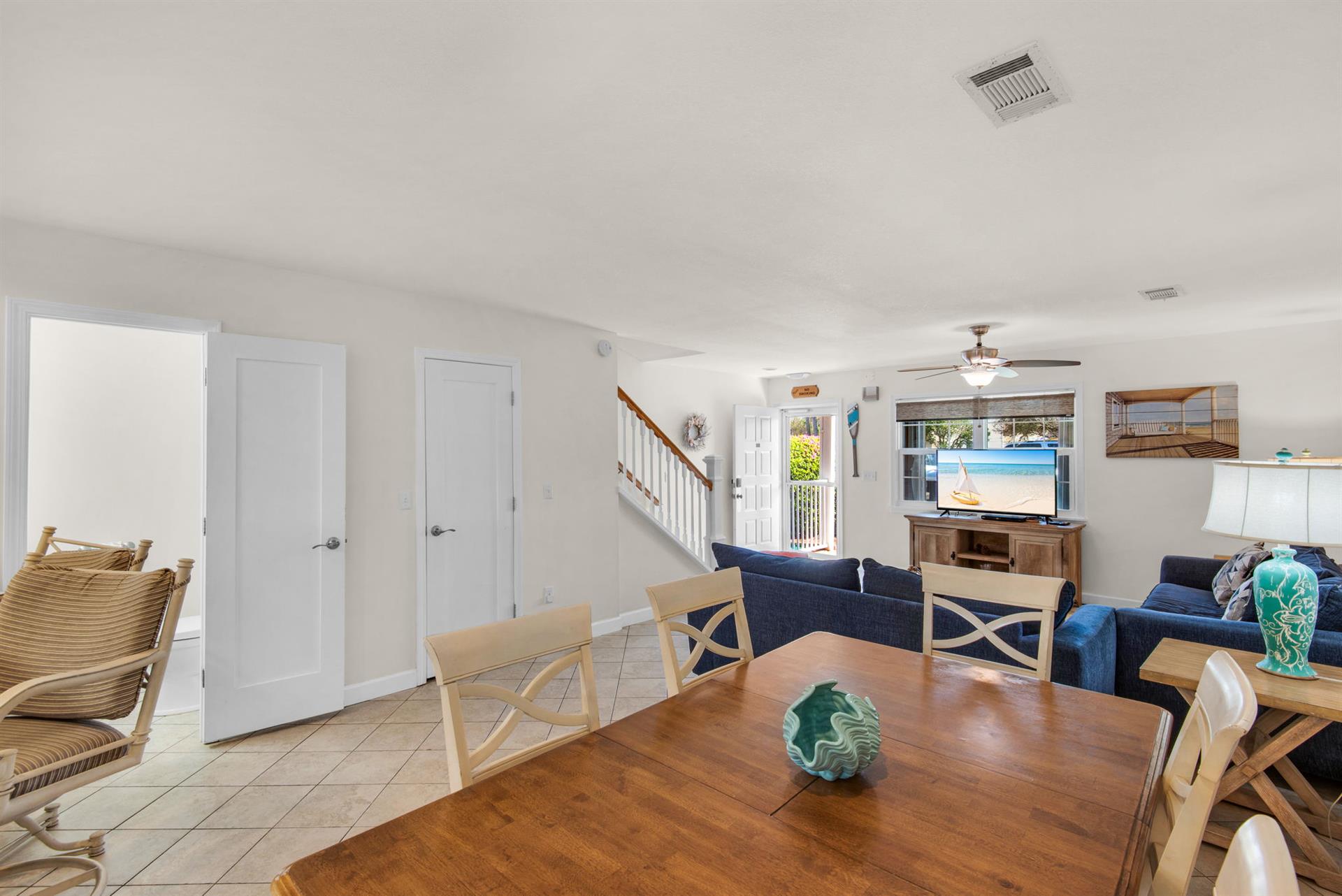 The ample sized dining table is open to the kitchen and living room
