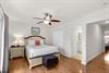 Located on the 2nd floor, bedroom 1 features wood floors, a ceiling fan and a private bathroom