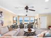Wake up to breathtaking Gulf views from your comfortable living space, where coastal breezes flow through while you relax on plush seating.