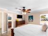 Drift off to sleep inthe spacious Guest bedroom with tropical artwork creating a coastal sanctuary.