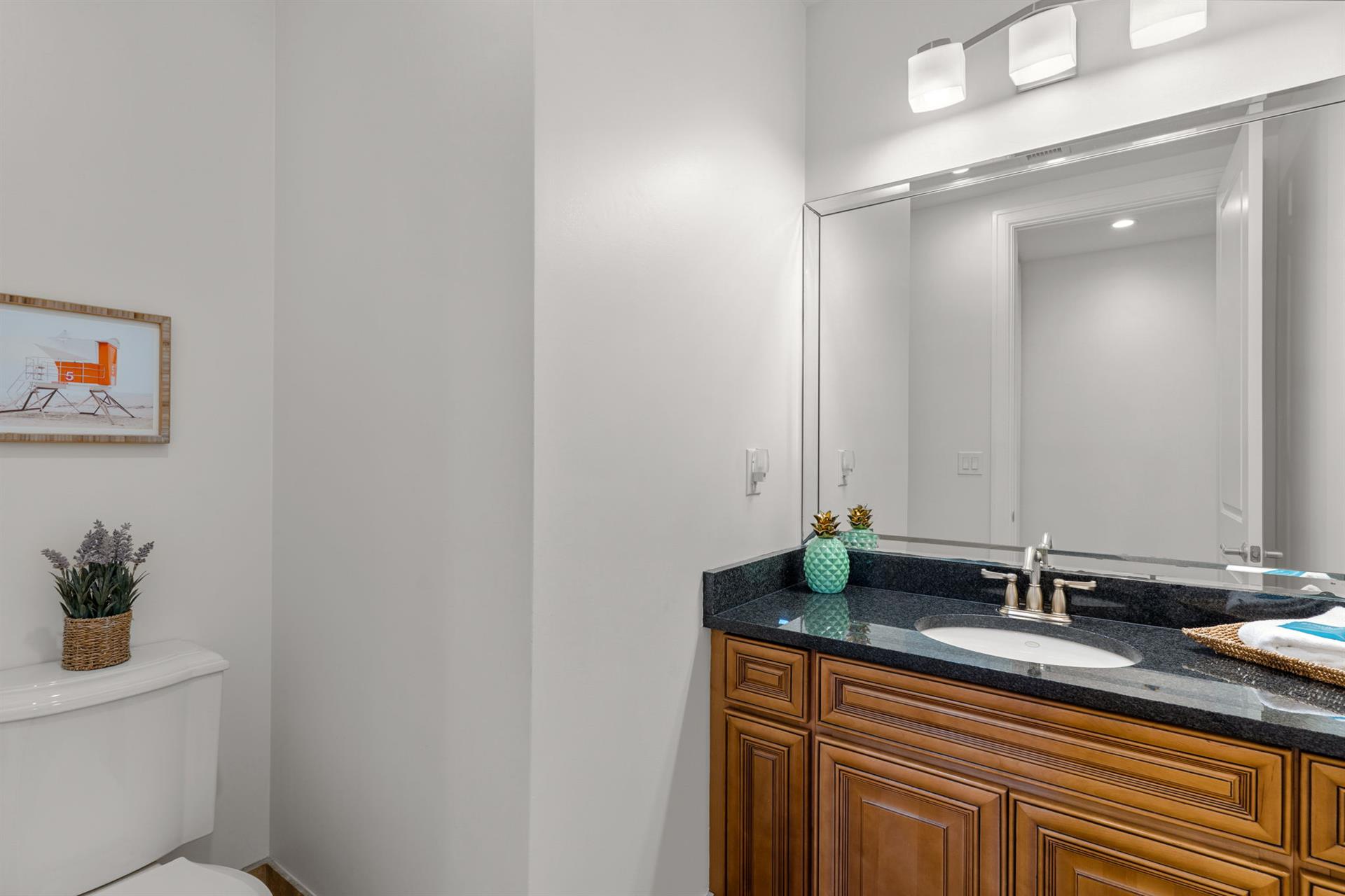 Half bathroom located just off the living area.