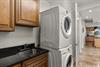 Private laundry area makes staying effortless with fullsize washer and dryer plus convenient sink for delicate care.