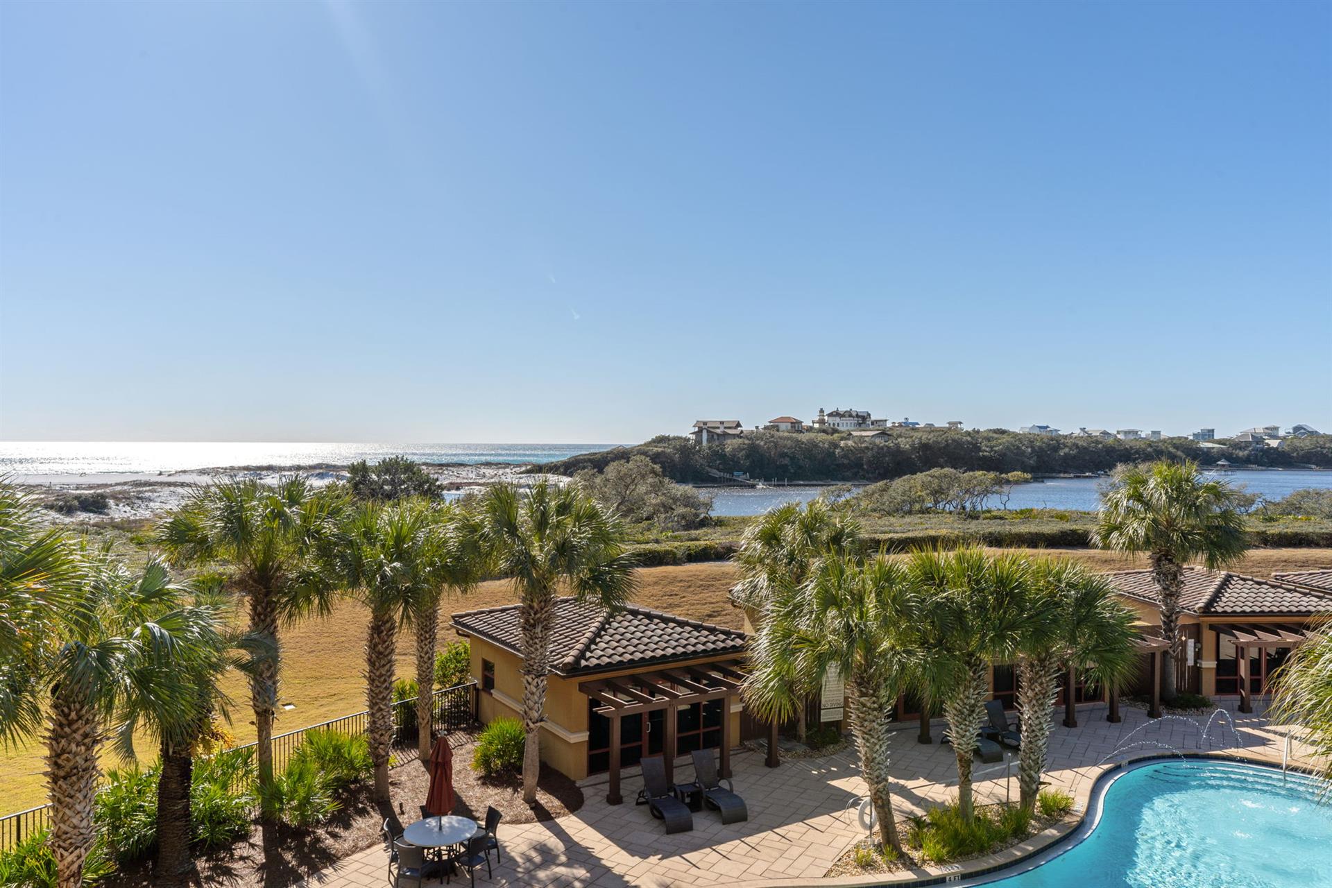 Soak in breathtaking coastline views surrounded by palm trees, a private pool, and expansive panoramic views of unspoiled beaches and winding waterways.