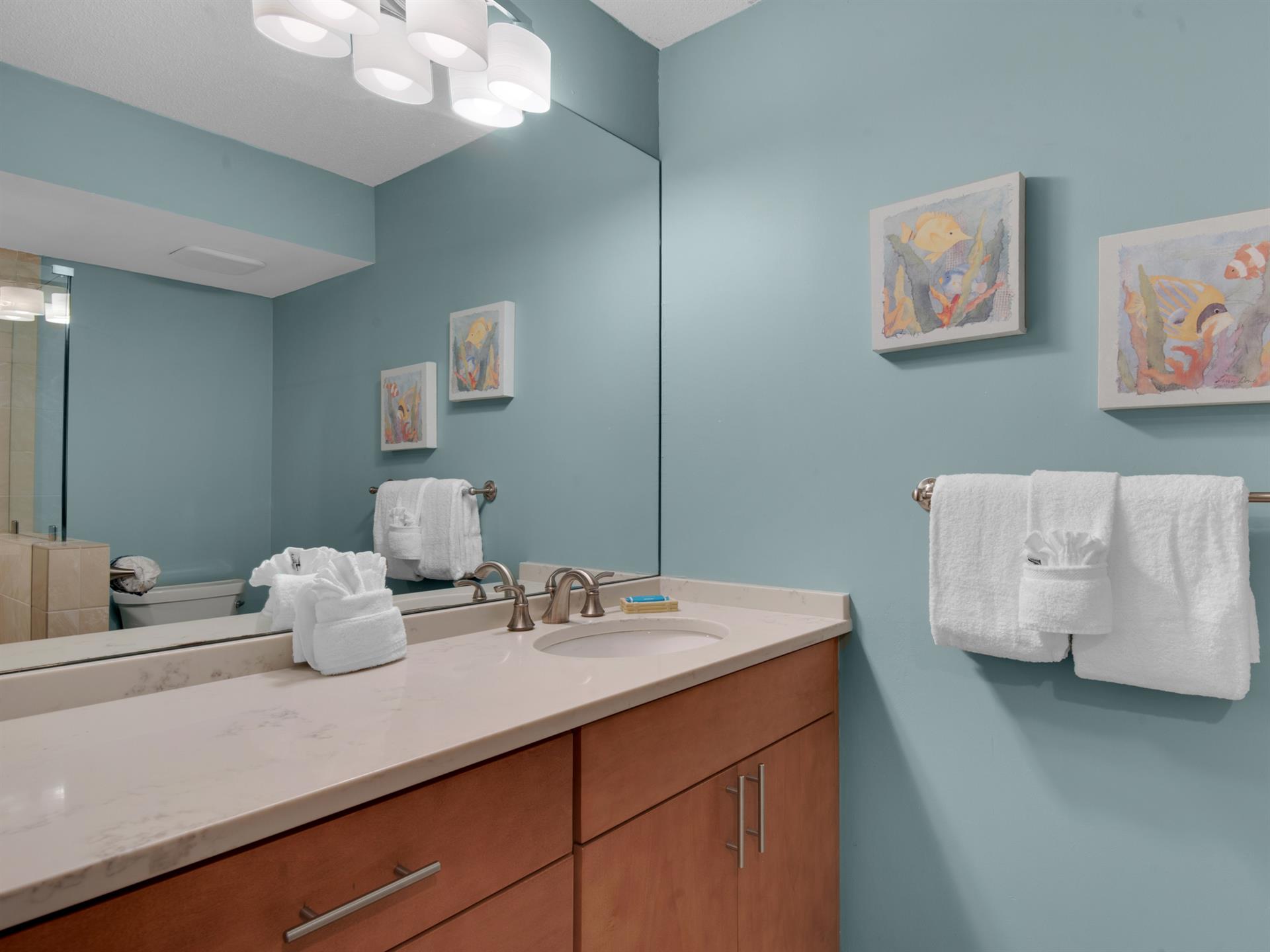 Bathroom 2 Your soothing bathroom features calming mint walls, modern fixtures, plush towels, and artwork creating a spalike retreat for your daily routine.