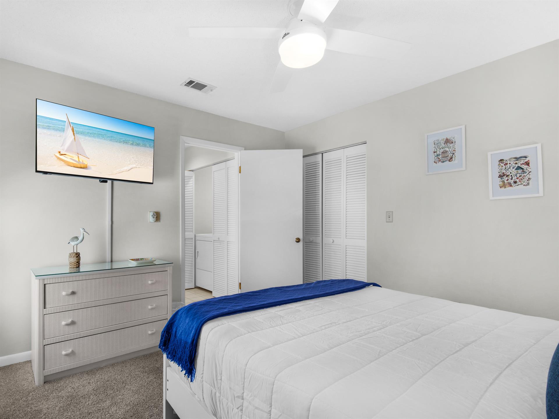 Bedroom 2  Drift off to sleep in your peaceful bedroom with a wallmounted TV and coastal artwork setting a serene mood.