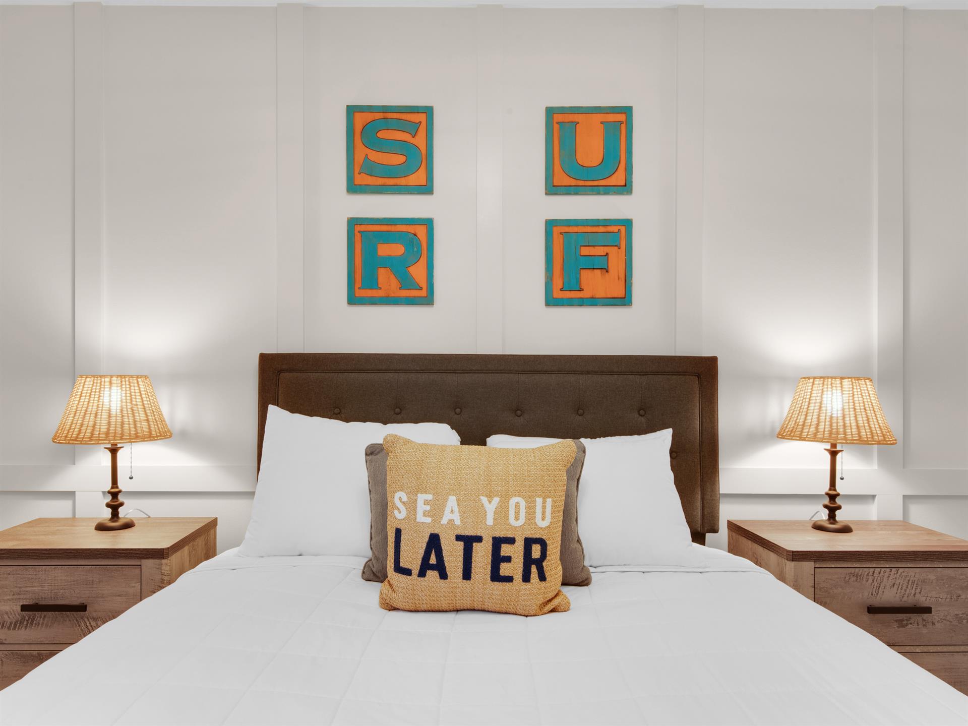 Bedroom 2  Beautiful accent wall with beachthemed artwork and playful pillows