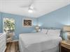 Bedroom 2  Drift off in your peaceful coastal bedroom, where soft blue walls and crisp white linens create the perfect seaside sanctuary.