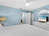 Bedroom 2 Unwind in your coastal bedroom with soothing blue walls and builtin entertainment center perfect for lazy evenings.