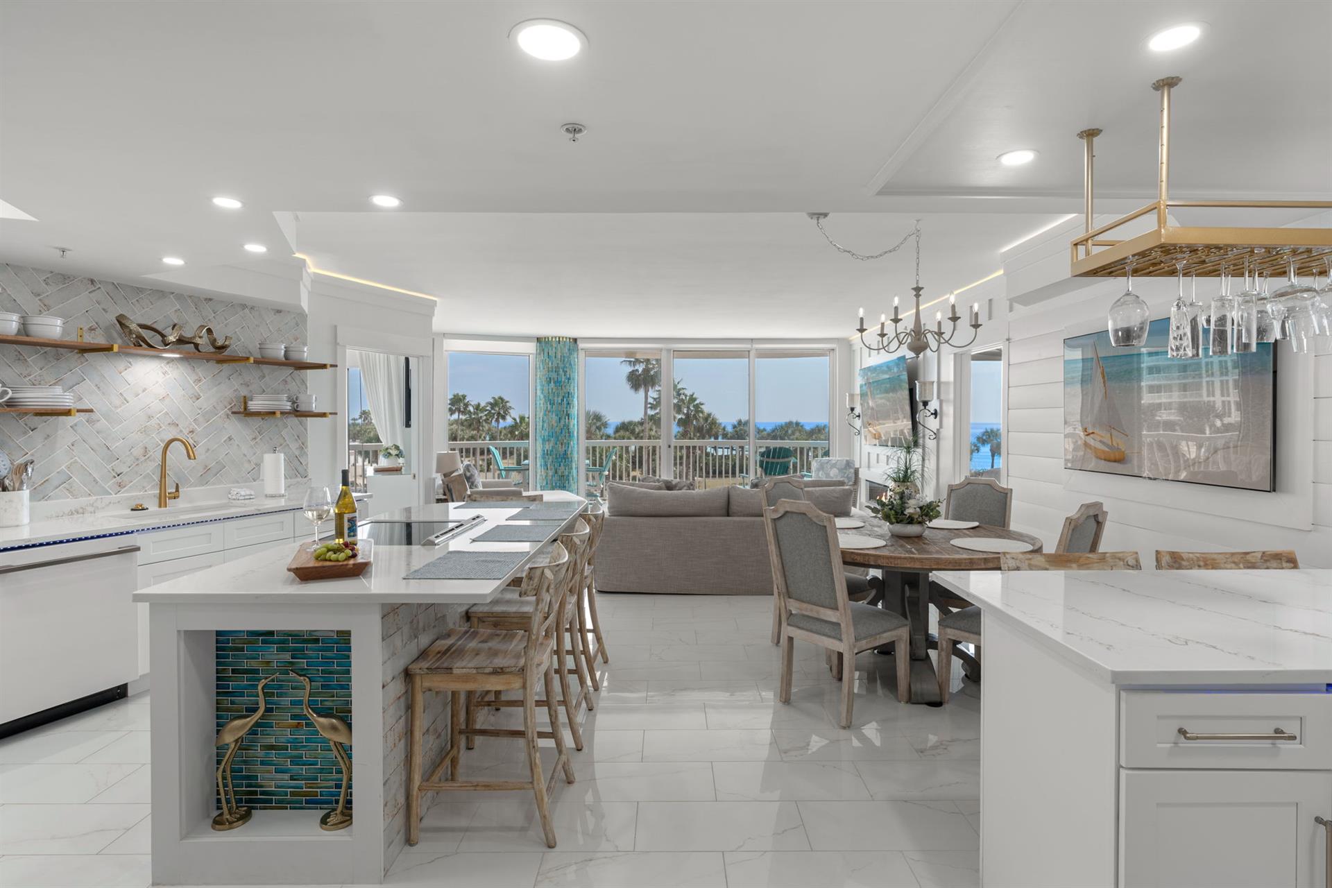 Your bright, openconcept living space flows seamlessly from kitchen to dining to lounge, with stunning ocean views through floortoceiling windows.