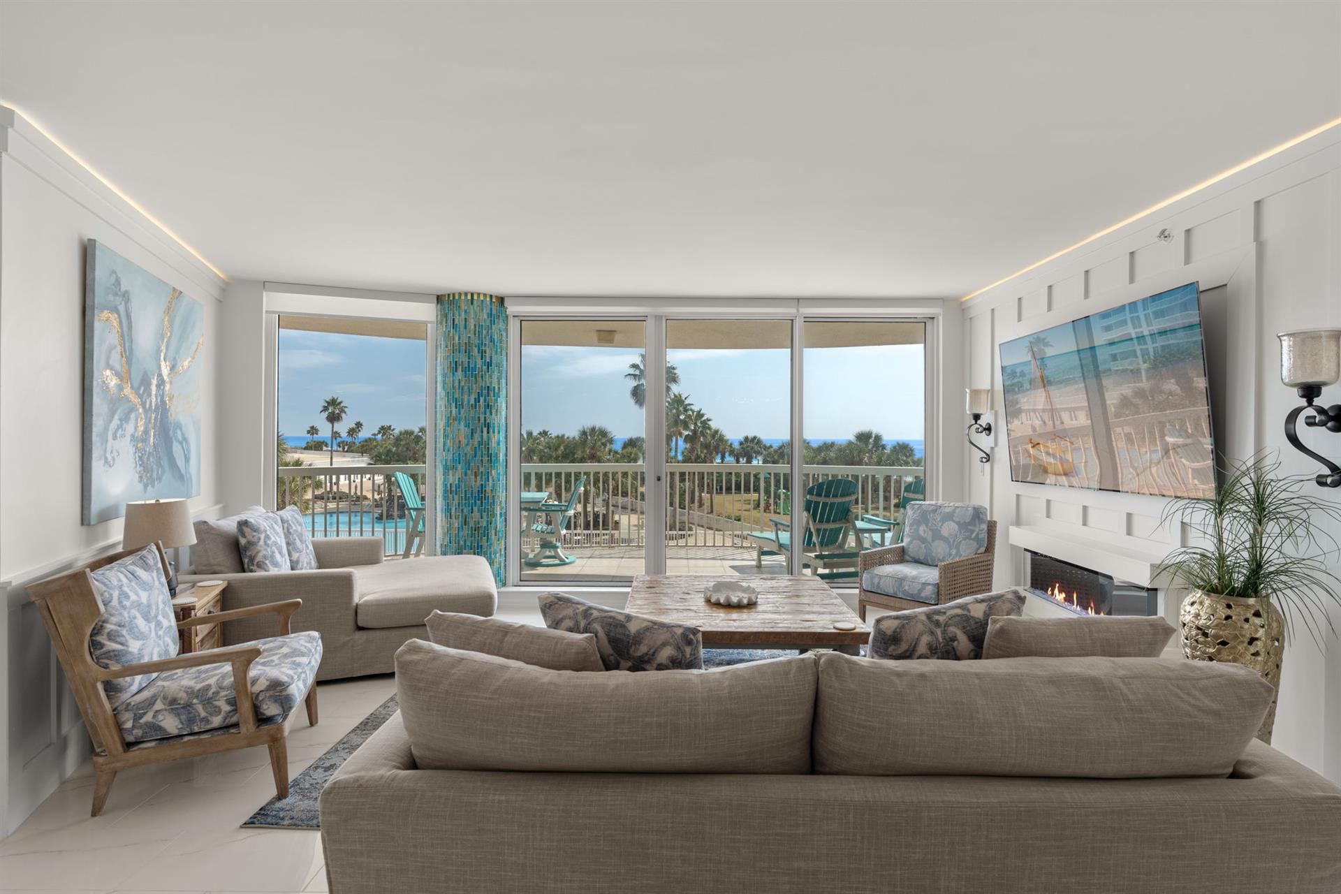 Unwind in your elegant living space where floortoceiling windows frame tropical views and coastal breezes flow through to your private balcony.