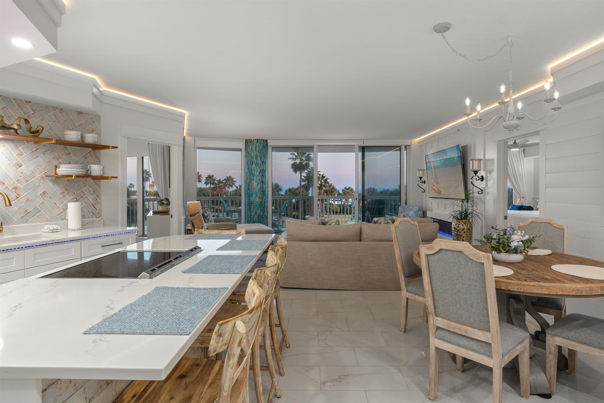 Open living space with stunning views of swaying palms creating perfect vacation vibes.
