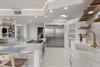 Your gourmet kitchen awaits with marble counters, gold fixtures, and professional appliances for culinary adventures.