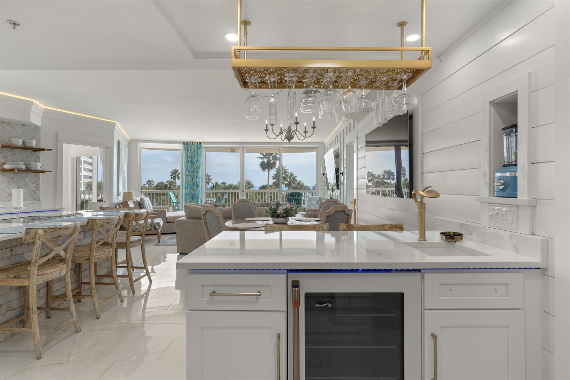 Relax in your bright, open kitchen flowing into the living space, with a great bar area.