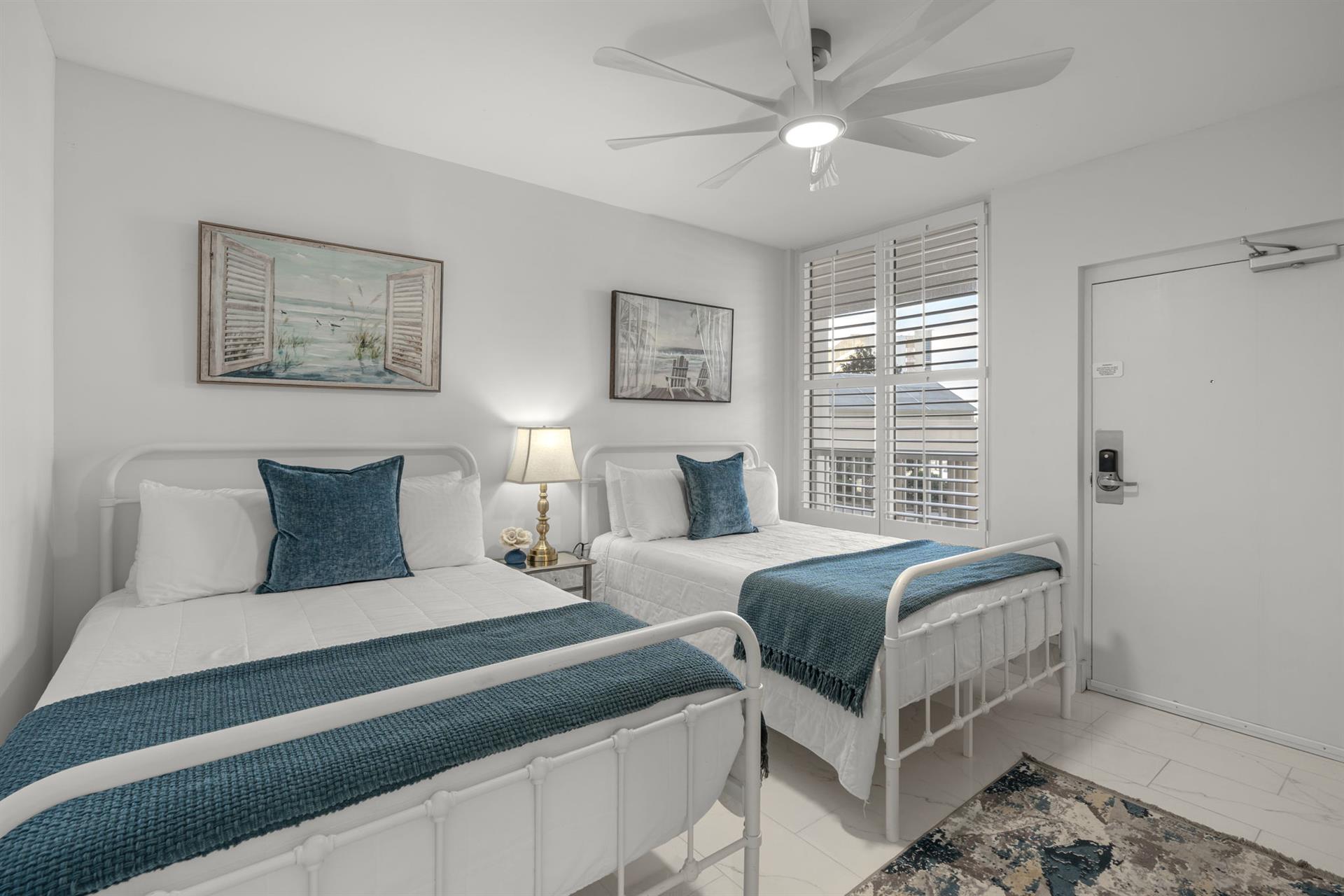 Bedroom 3 features 2 double beds.