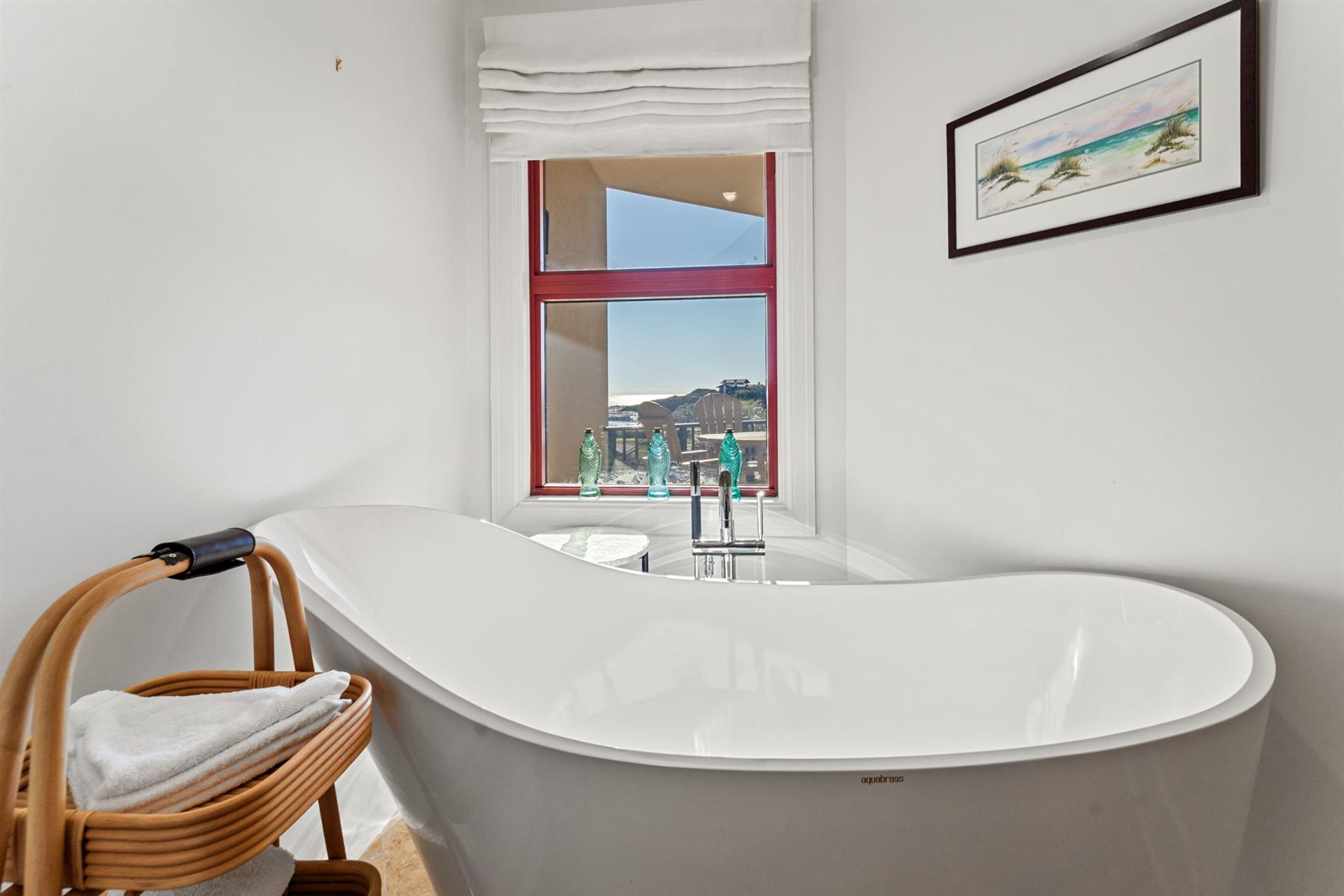 Enjoy a serene bath with sunset views for the perfect end to your day.