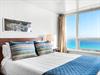 Wake up to stunning Gulf views from Bedroom 1. The panoramic windows frame endless blue waters, creating a serene sanctuary.