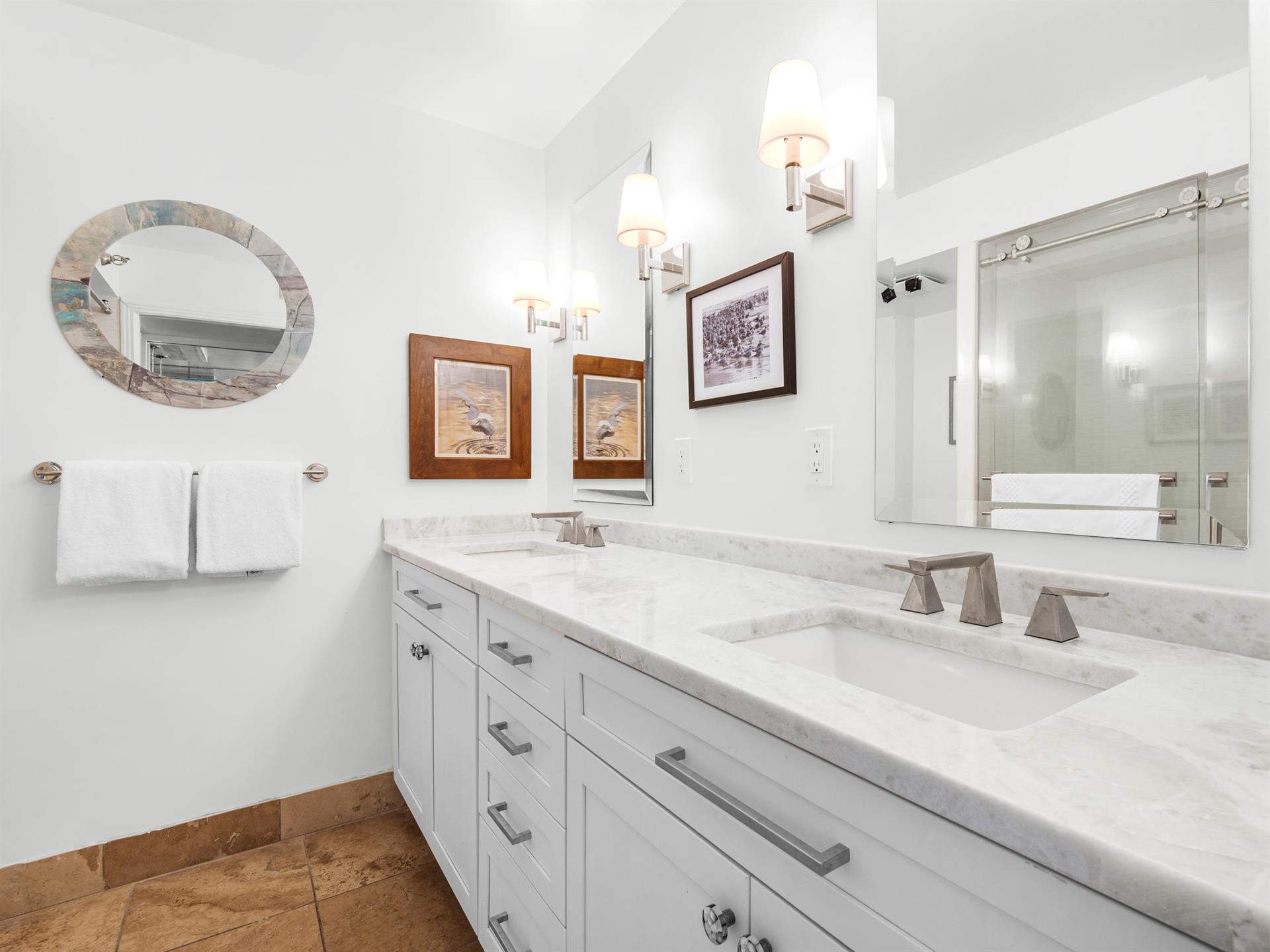 Bathroom 1 features convenient double vanity sinks