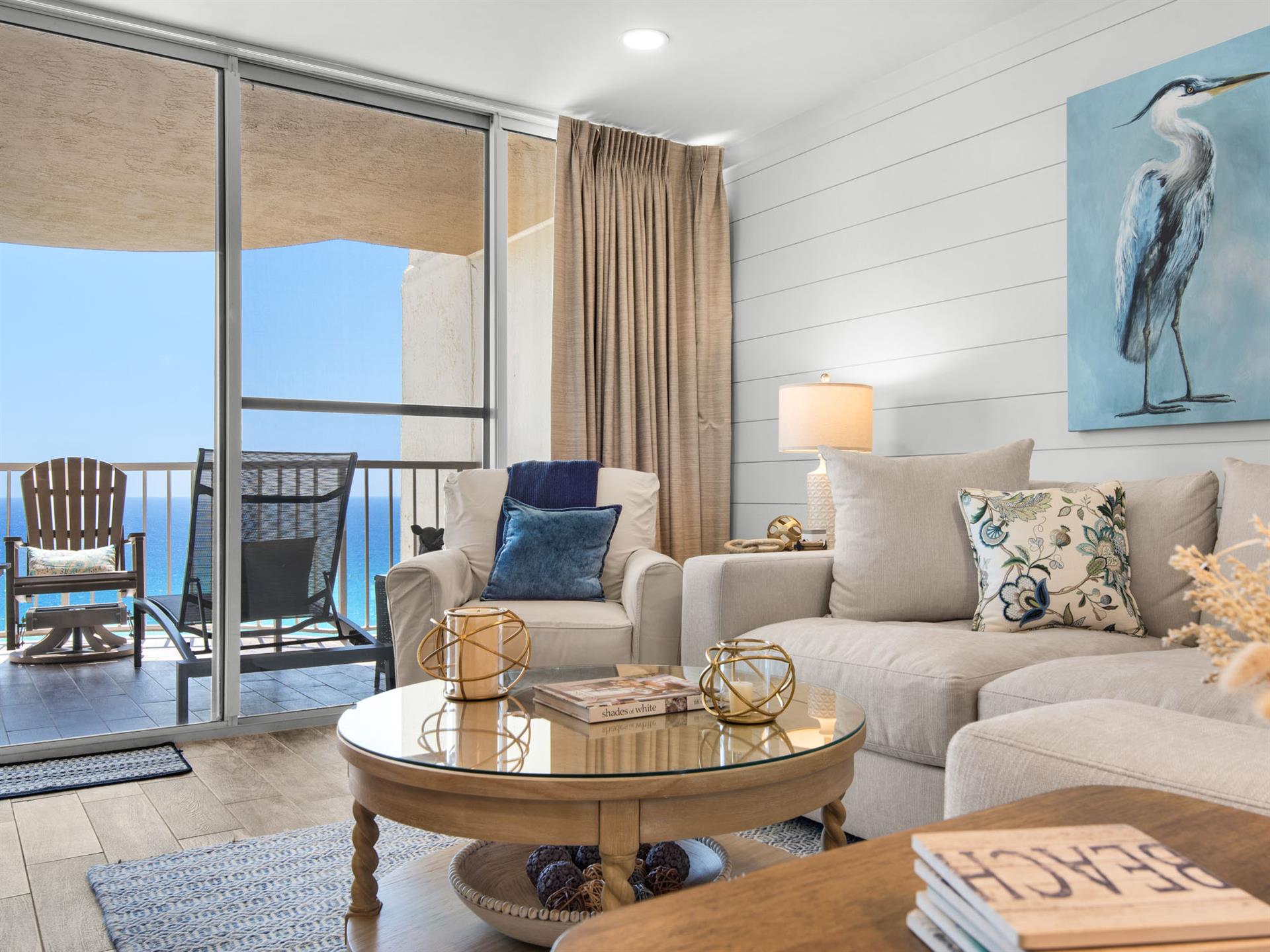 Unwind in your coastal living room where plush sofas and ocean breezes create the perfect beach retreat.