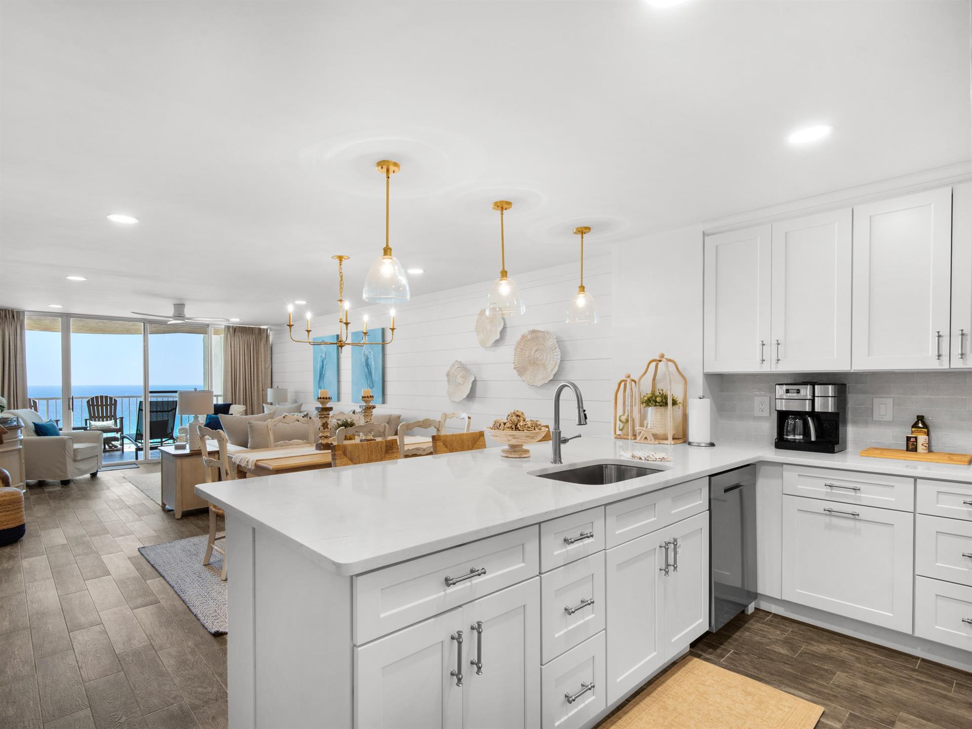 Your gourmet kitchen flows into the living space, creating the perfect spot for morning coffee while admiring breathtaking ocean views.