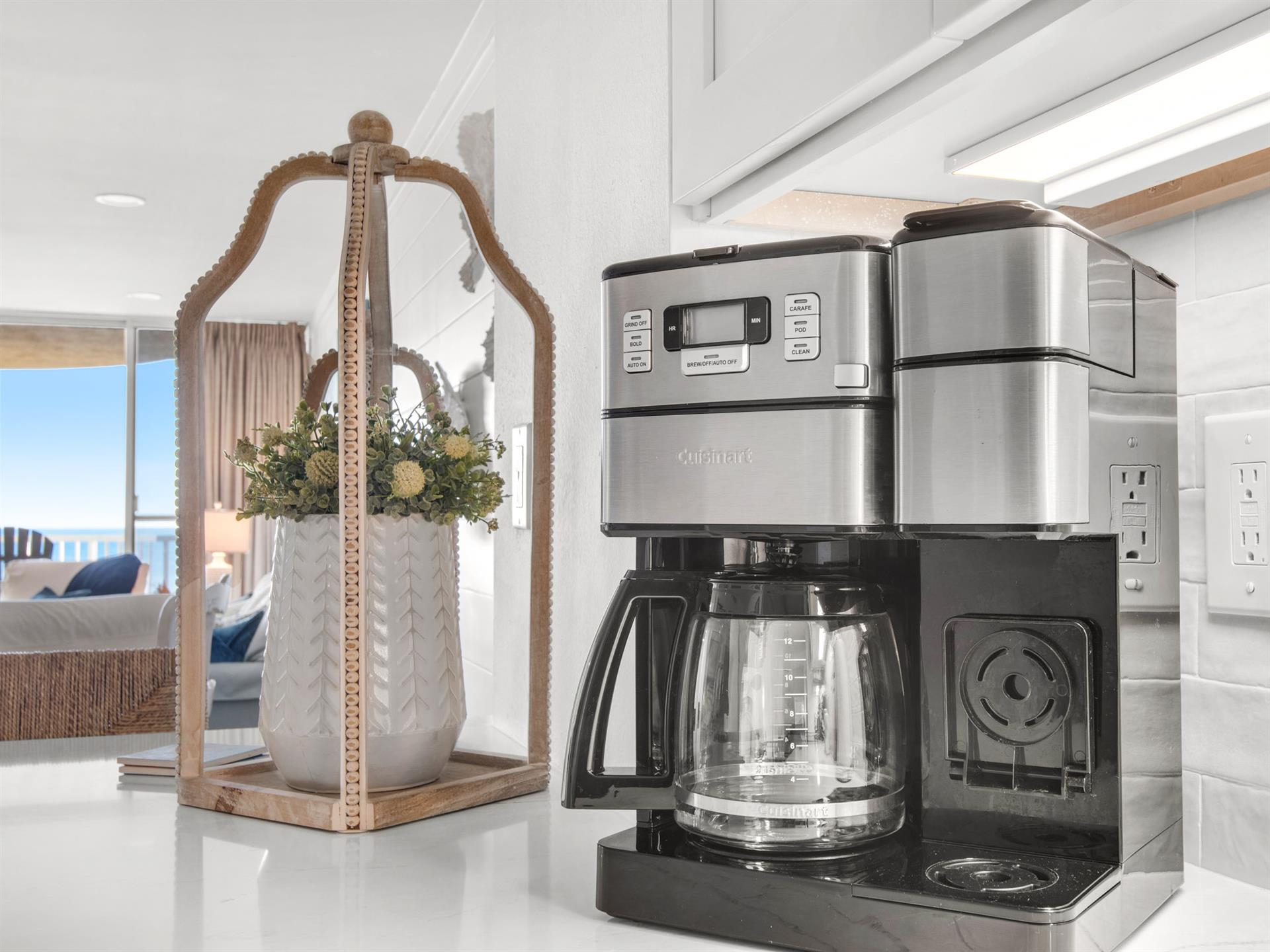 Start your mornings with freshly brewed coffee in this bright, wellequipped kitchen featuring modern appliances and coastal views.