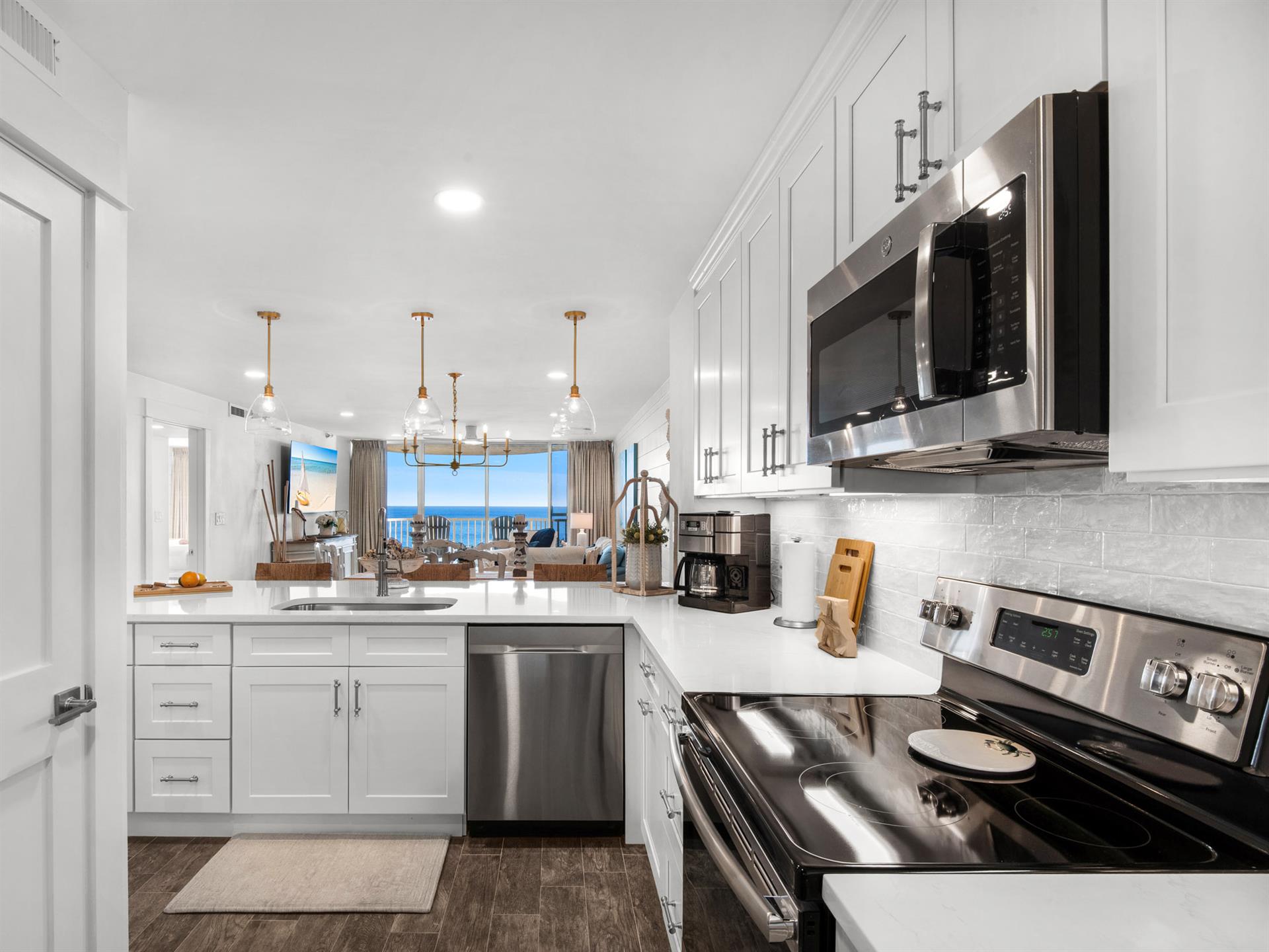 Your dream kitchen awaits with sparkling countertops, stainless steel appliances, and ocean views that make every meal magical.
