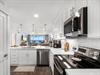 Your dream kitchen awaits with sparkling countertops, stainless steel appliances, and ocean views that make every meal magical.