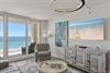 Sink into coastal elegance where ocean views frame your living space through floortoceiling windows, creating your perfect seaside sanctuary.