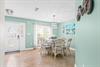 Dining area, perfect place for meals or family game time. Additional seating at breakfast bar in kitchen.