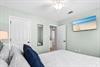 Bedroom 2 with queen bed and TV