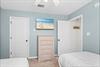 Bedroom 3 with 2 twin beds and TV